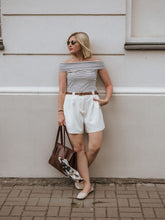 You can wear a-line shorts with a plaid shirt.